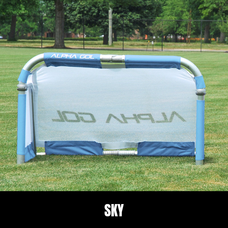 Sky folding soccer goal on grass, front view, silver aluminum frame with white mesh netting