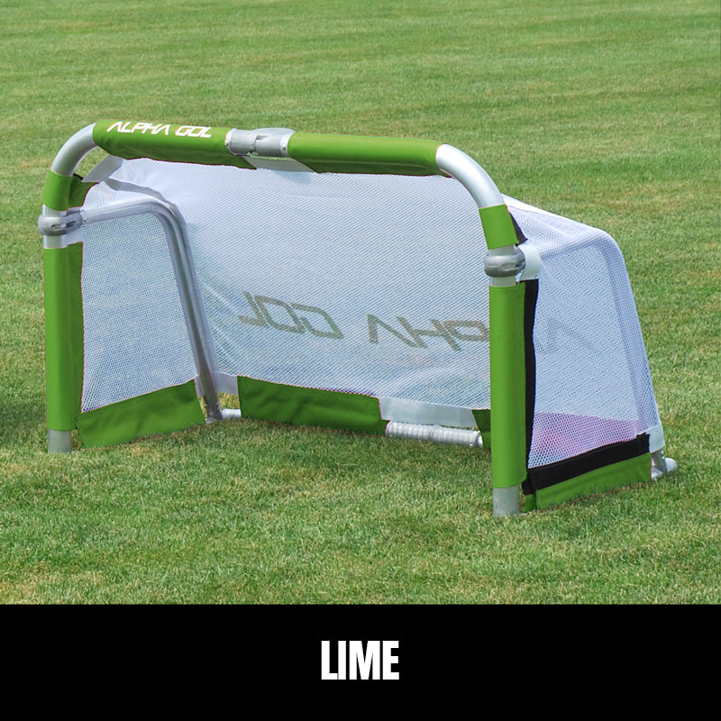 Lime folding soccer goal on grass, front view, silver aluminum frame with white mesh netting
