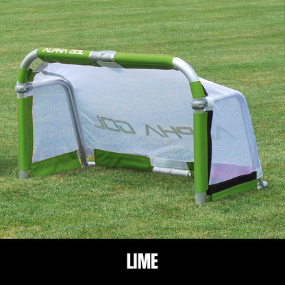 Lime folding soccer goal on grass, front view, silver aluminum frame with white mesh netting