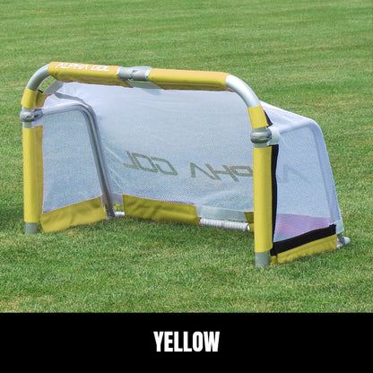 Yellow folding soccer goal on grass, front view, silver aluminum frame with white mesh netting