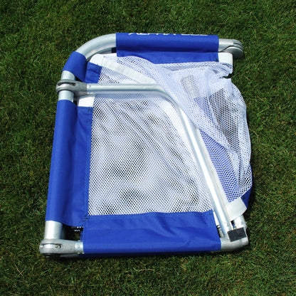 Royal folded soccer goal on grass, folded view, silver aluminum frame with white mesh netting