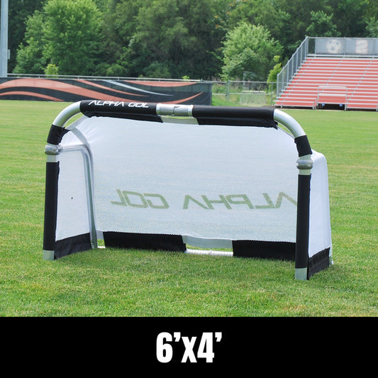 Black folding soccer goal on grass, front view, silver aluminum frame with white mesh netting